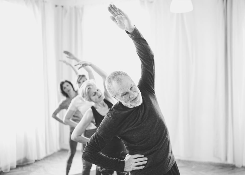 Group of Senior People Doing Exercise in Community Center Club.