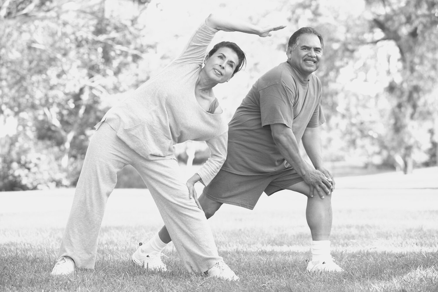 Senior Couple Exercising in Park